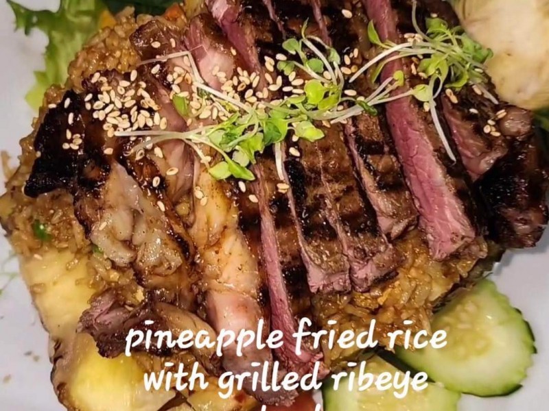 (L).Pineapple Fried Rice Pineapple Fried Rice with Grilled Ribeye Steak