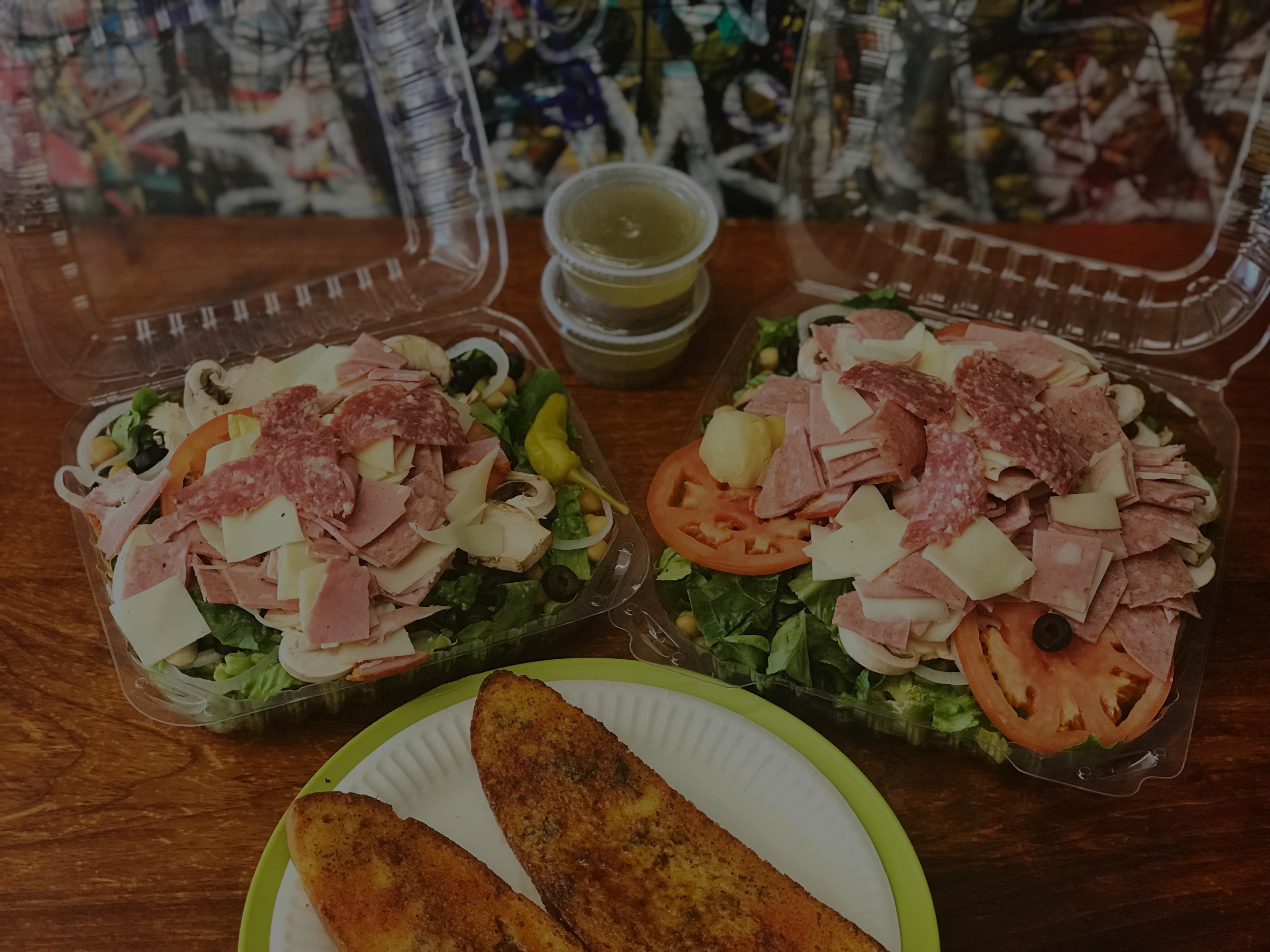 Catering trays of salads and garlic bread