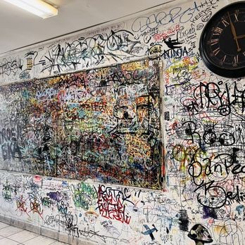 The wall inside Joe Peep's, covered edge to edge in customers' signatures