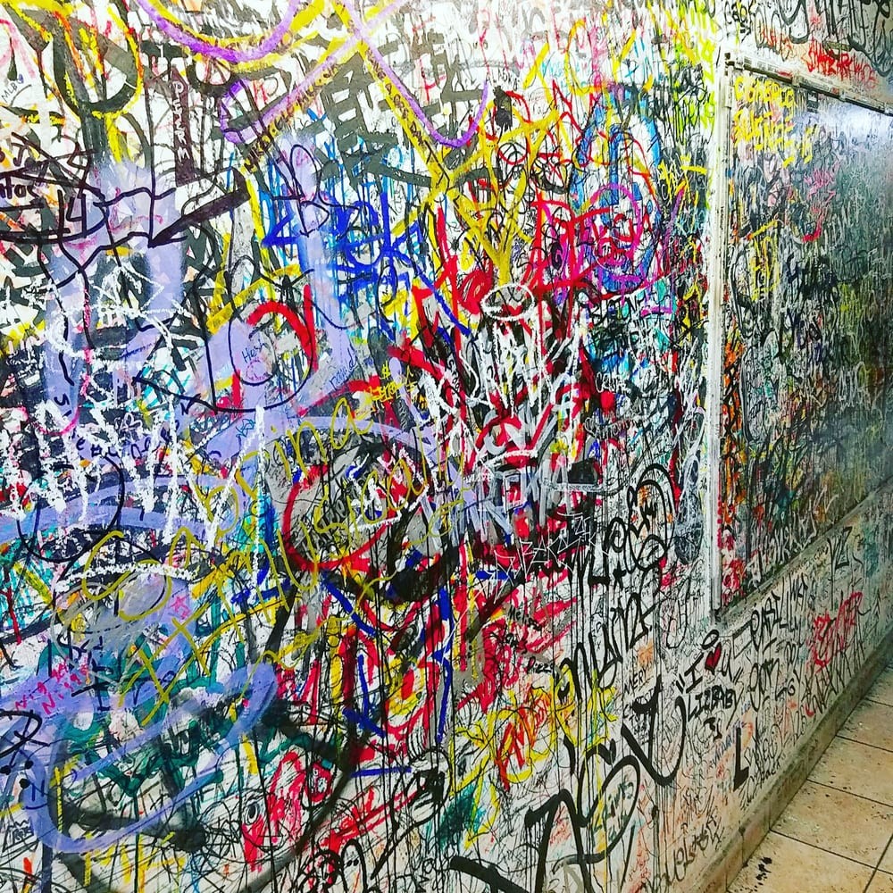 The wall inside Joe Peep's, covered edge to edge in customers' signatures